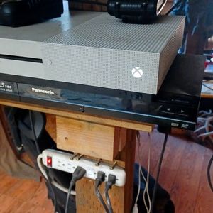 Xbox one x with games and controllers